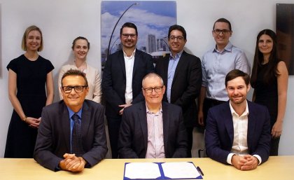 Front row: UQ School of Civil Engineering head Professor Simon Washington, UQ Director of Research Partnerships Joe McLean, VLC CEO Tim Veitch. UQ's Dr Jake Whitehead (back row, third from left) Front row: UQ School of Civil Engineering head Professor Simon Washington, UQ Director of Research Partnerships Joe McLean, VLC CEO Tim Veitch. UQ's Dr Jake Whitehead (back row, third from left)